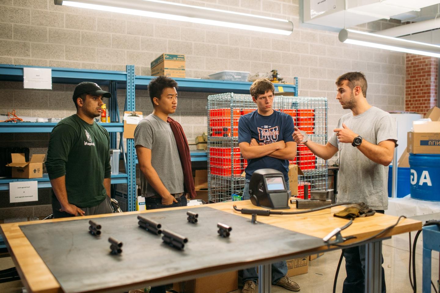 Student engineers discuss racecar project